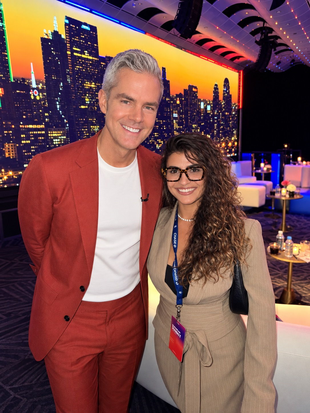 Lorena Alves standing beside Ryan Serhant